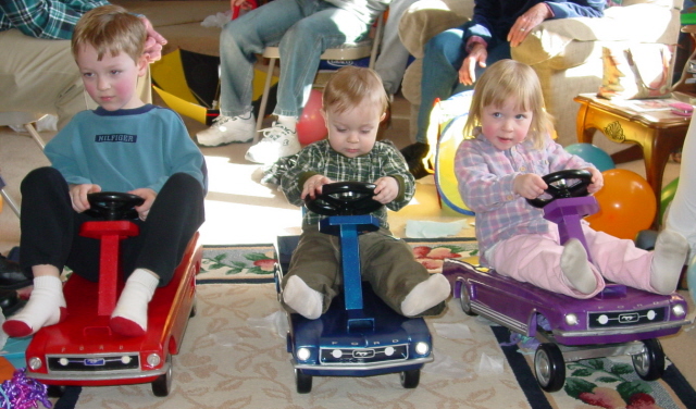 Daniel, Mary, and Matthew with their Mustang Rocking Horses